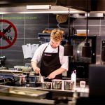 professional chef cooking in commercial kitchen